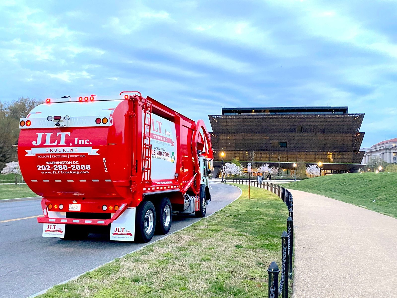 JLT Inc. waste truck operating on the streets of Washington, DC